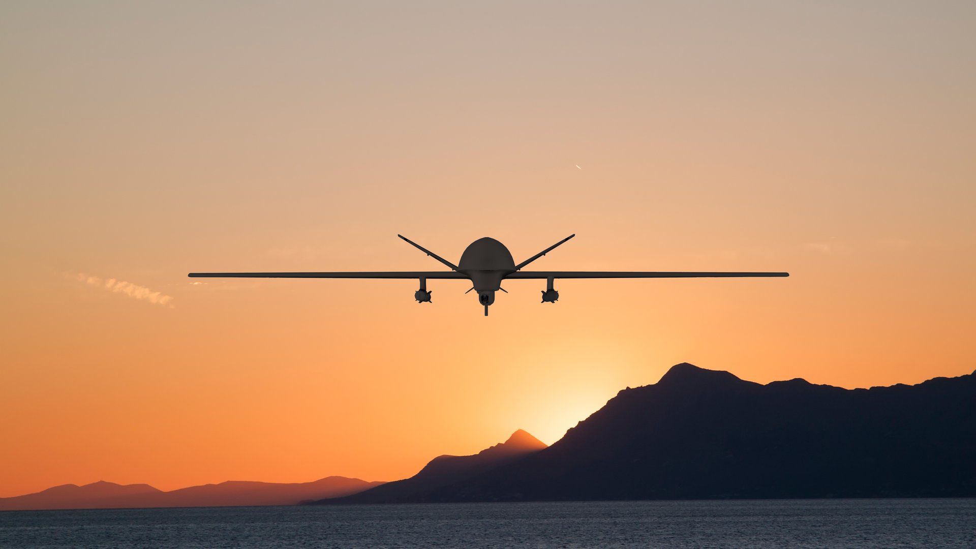 Fixed-wing UAV in flight at sunset